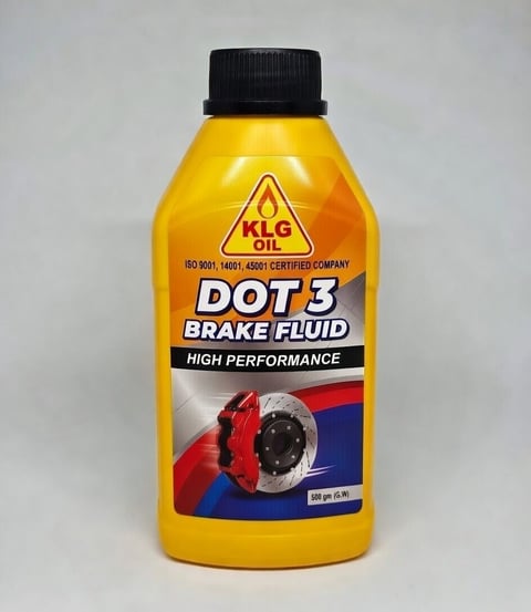 KLG DOT 3 brake fluid bottle with yellow label and black cap on white background